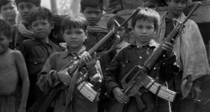 Kids Holding Large Guns