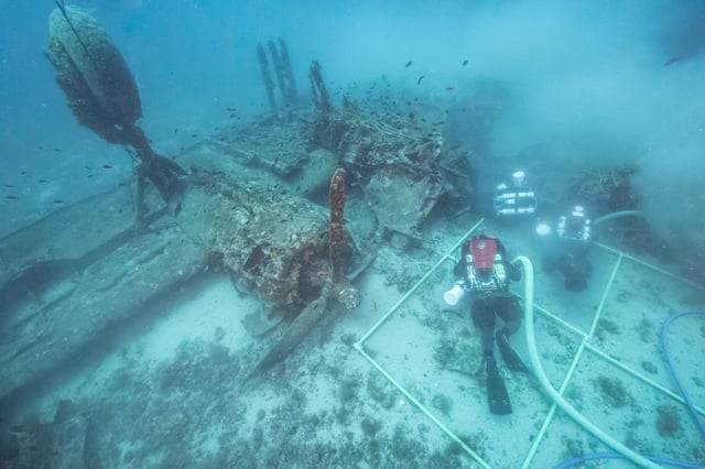 New Footage Shows Divers Recovering Bones From Sunken WWII Aircraft