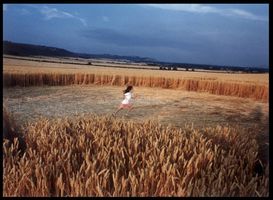 Child Running Through A Crop Circle