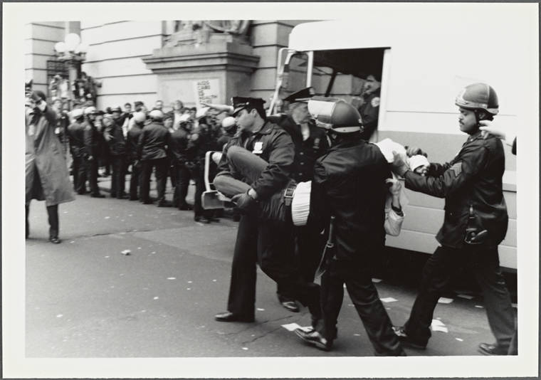 Police Carrying Protester