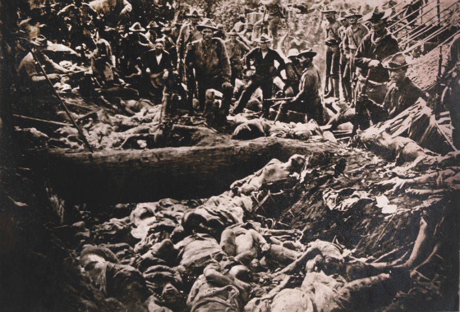 American Soldiers Inspect Insurgent Casualties