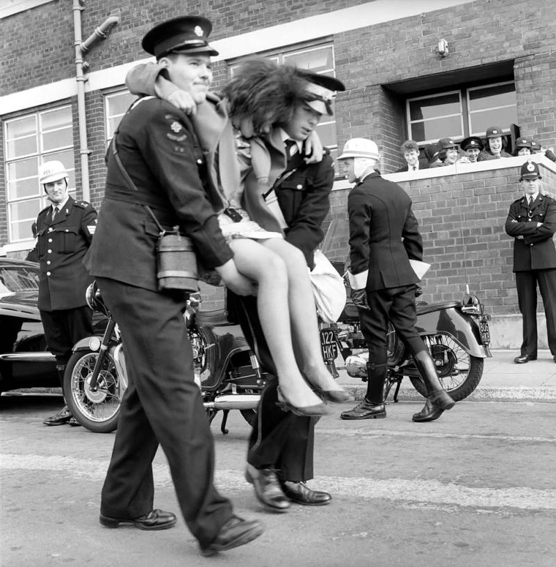 Police Carrying Beatles Fan