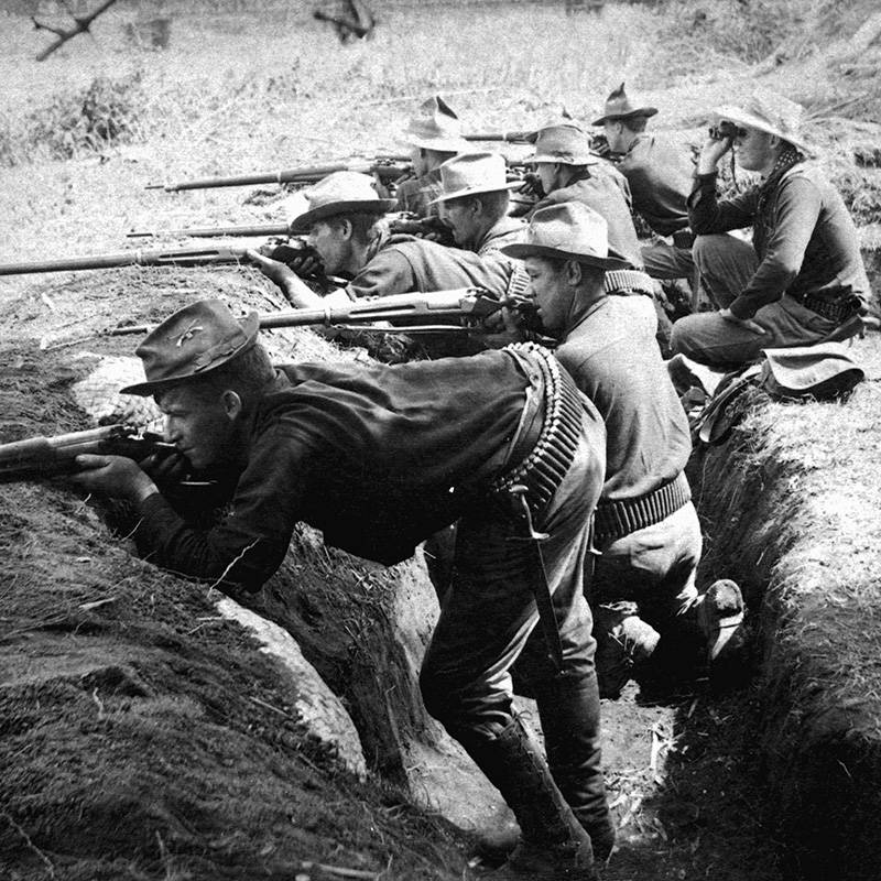 Soldiers Fire From Trenches