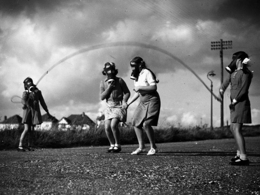 Girls Wearing Gas Masks Playing