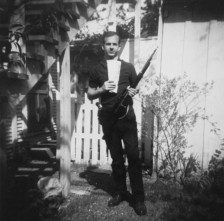 Lee Harvey Oswald poses withhis rifle