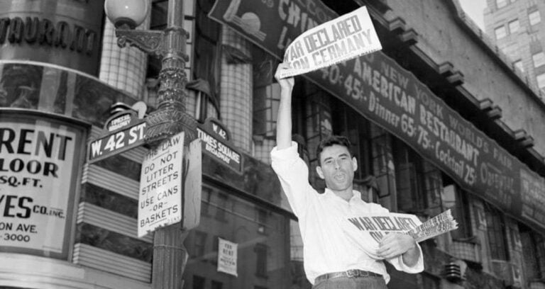 Man Selling Newspapers In Times Square Featured