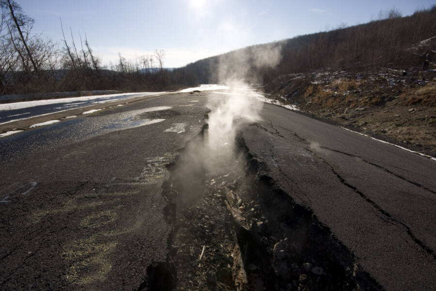 The main highway running through Centralia, Route 61, has had to be rerouted. The former road is cracked and broken and regularly spews clouds of smoke from the fires burning beneath it
