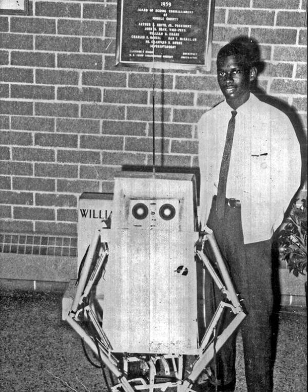 Lonnie Johnson Beside His First Robot