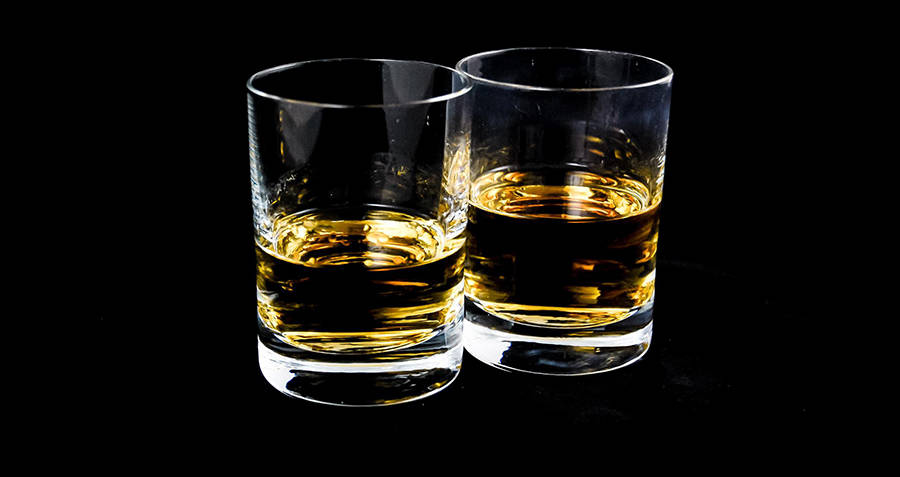 Whiskey glasses black background