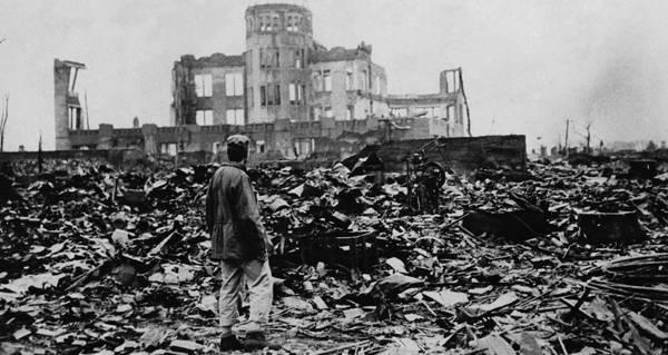 Man Standing Amid Rubble
