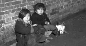 Two Children Against Wall