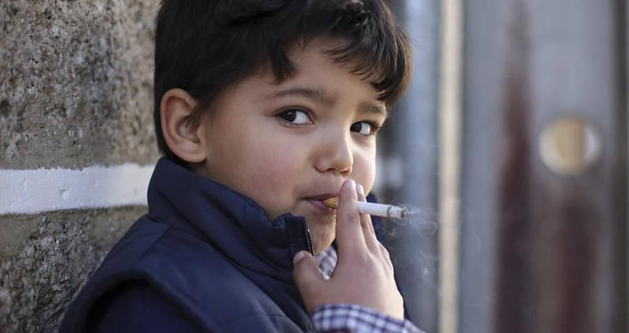 Child Young boy smoking in Portugal