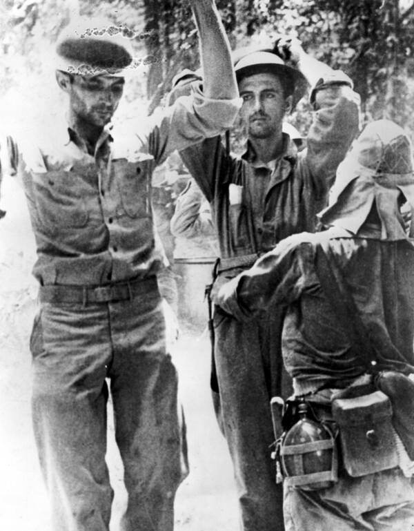 Japanese Soldier Searching US POWs