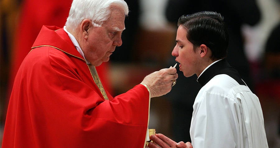 Bernard Law Feeding Communion To Boy