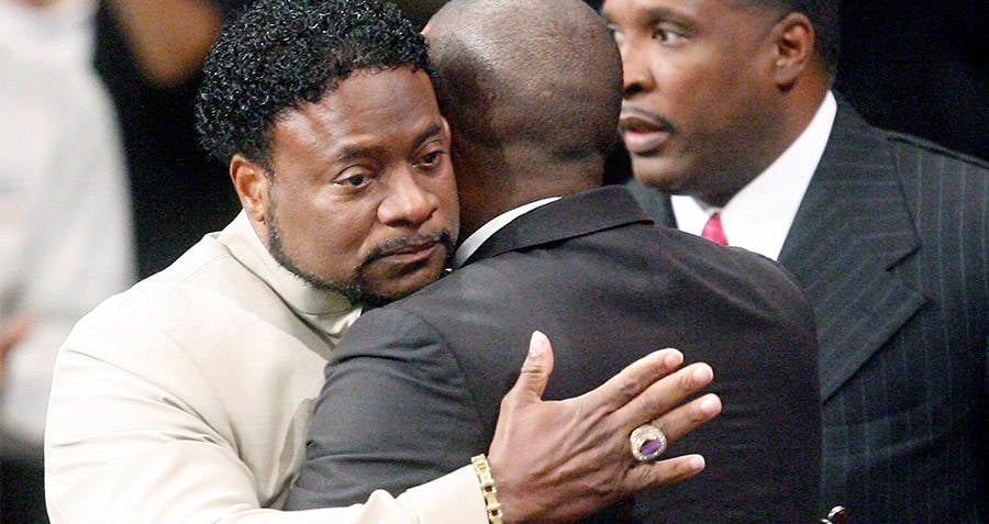 Eddie Long Hugging Man