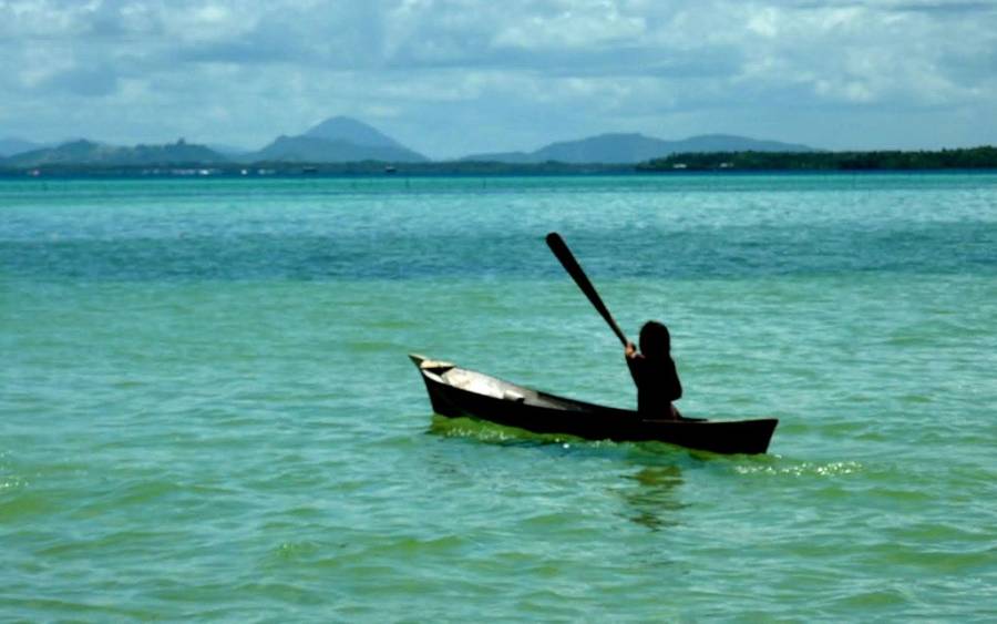 Person Rowing A Boat