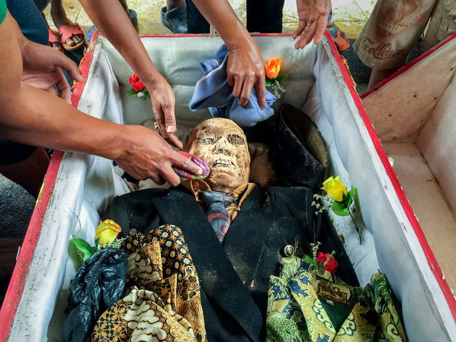 Cleaning Off Toraja Mummy