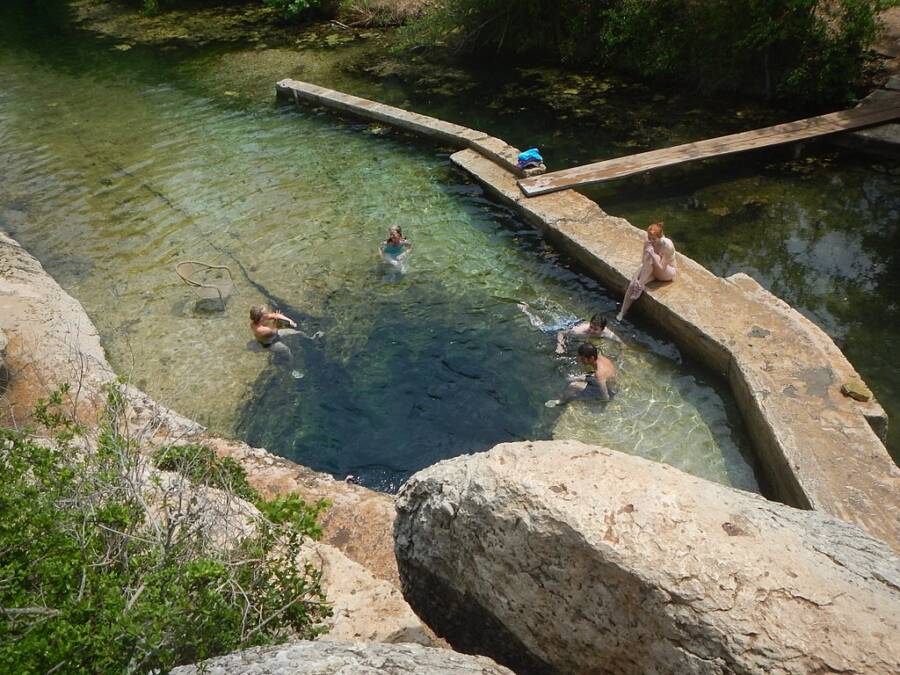 People Sit Around Jacobs Well