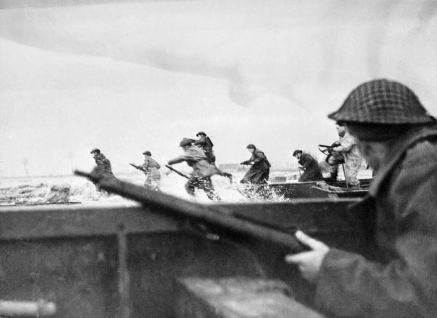 Soldiers Charge The Beach During D-Day Invasion