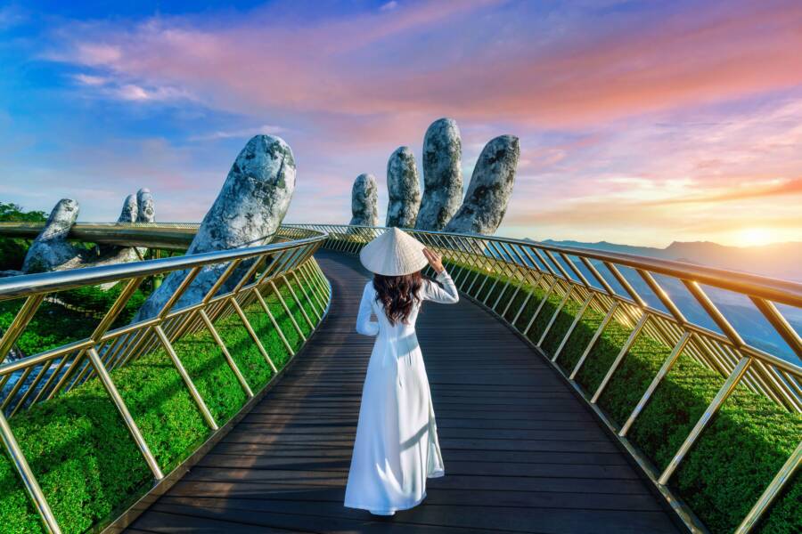 Tourist Walking On Golden Bridge
