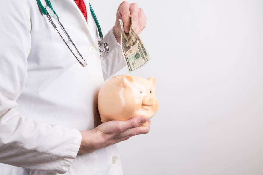 Doctor With Piggy Bank