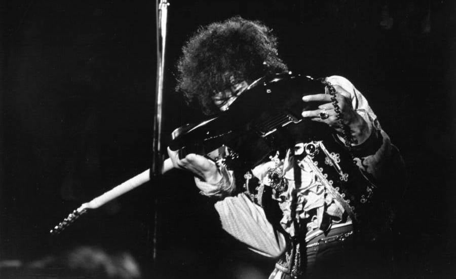 Jimi Hendrix Playing Guitar With His Teeth
