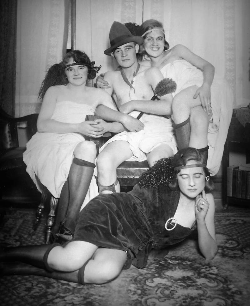 Man surrounded by 4 flappers