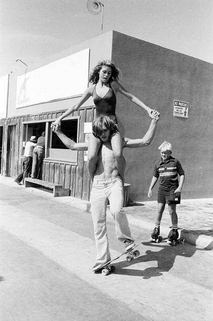 Skaters And Woman On Shoulders