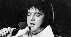 Elvis Holding A Microphone