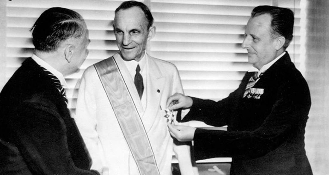 Henry Ford American Icon Businessman And Staunch Nazi Sympathizer   Henry Ford Smiles With German Cross Featured 