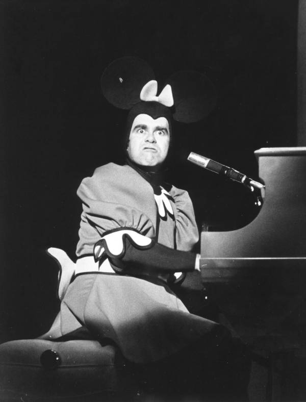 Elton John In Micky Mouse Costume At Piano