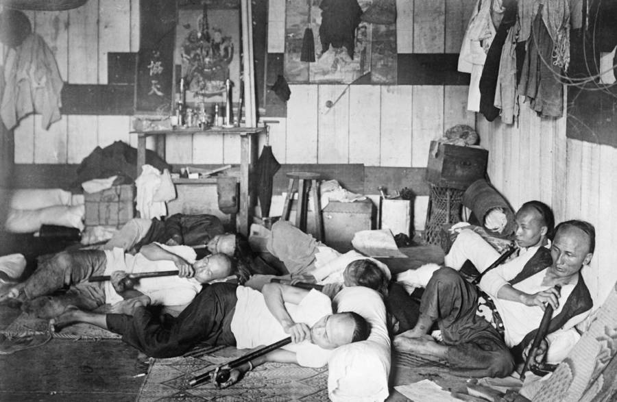 People Relaxing In New York Opium Den