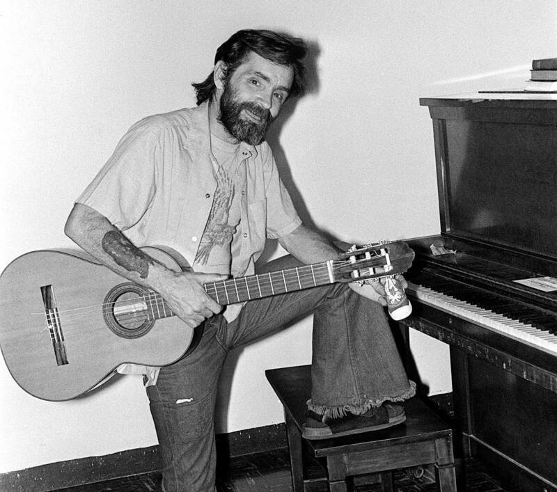 Charles Manson Playing Guitar