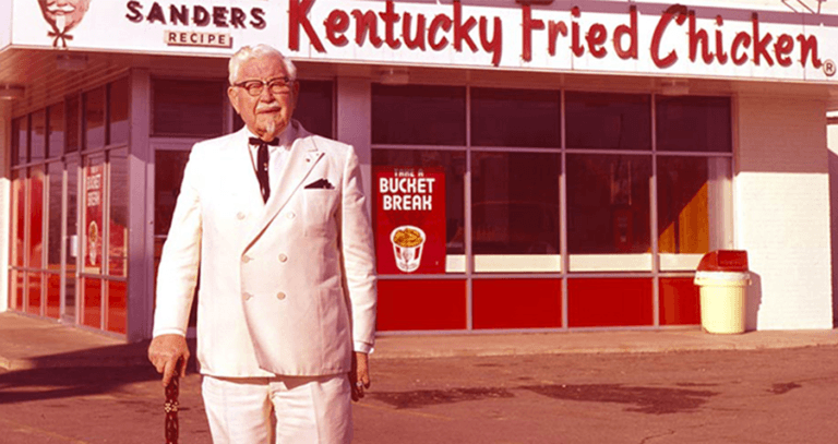 Colonel Sanders In Front Of Early Kfc