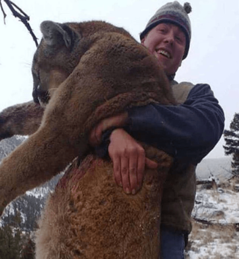 Montana Hunter Hugs Dead Mountain Lion Copy