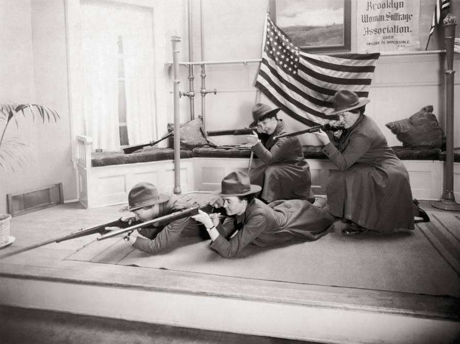 Women In Uniform Shoot Before Flag