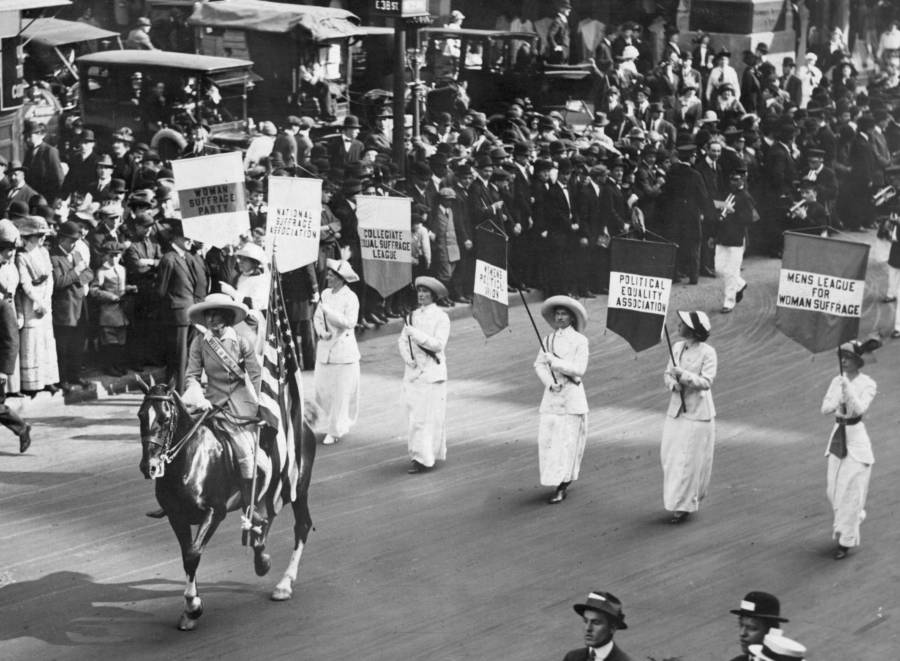 Four Women In White With Flags Lead Giant Procession