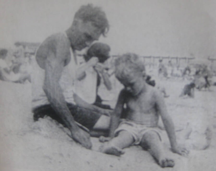 Baby Bundy In Sand With Grandpa