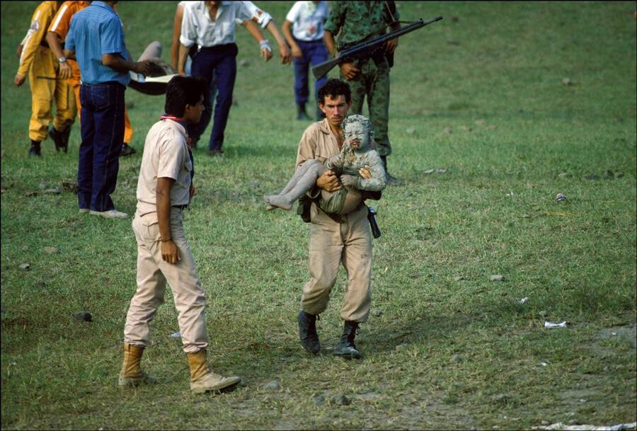 Rescuer Carrying An Armero Victim