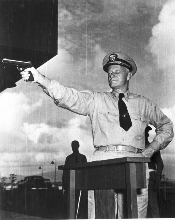 Admiral Chester Nimitz Firing A Gun