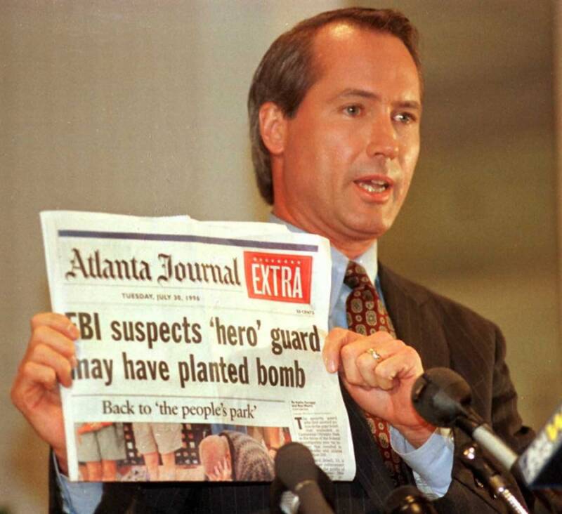 Lin Wood Holds Newspaper With Olympic Park Bombing Headline