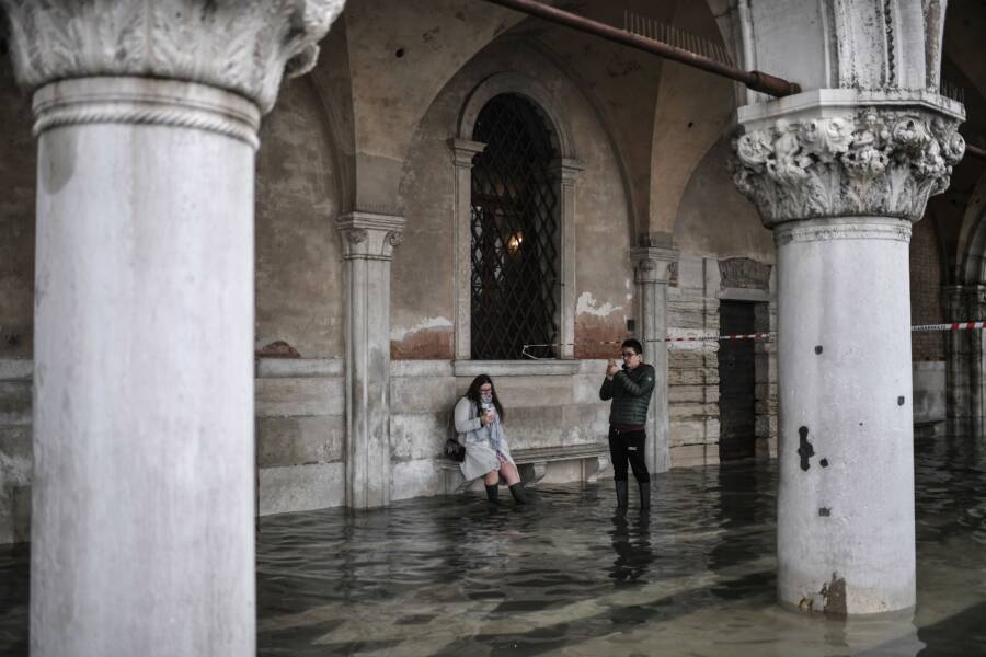 Tourists Photographing Venice Flood