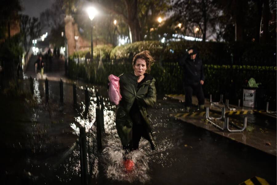 Woman Walking In Venice Flood