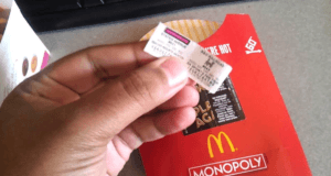Holding Mcdonalds Monopoly Ticket