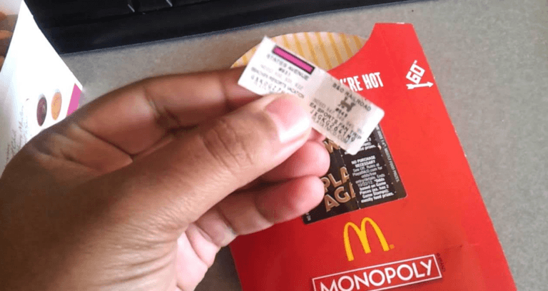 Holding Mcdonalds Monopoly Ticket