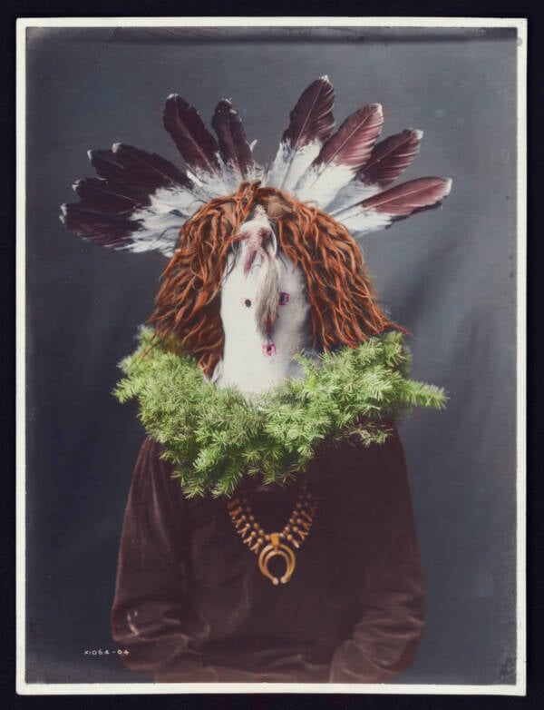 Native American Man Wearing Feathered Mask