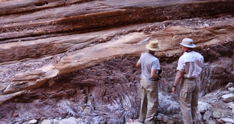 People Observing Rock Layers Featured