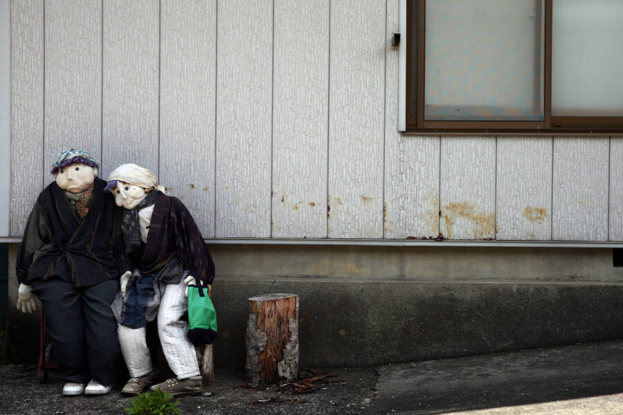 Dolls Outside Abandoned House