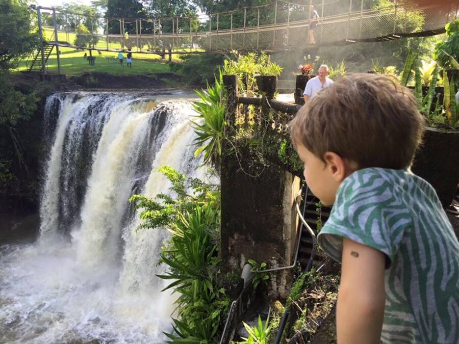 Kid Overlooking Waterfall