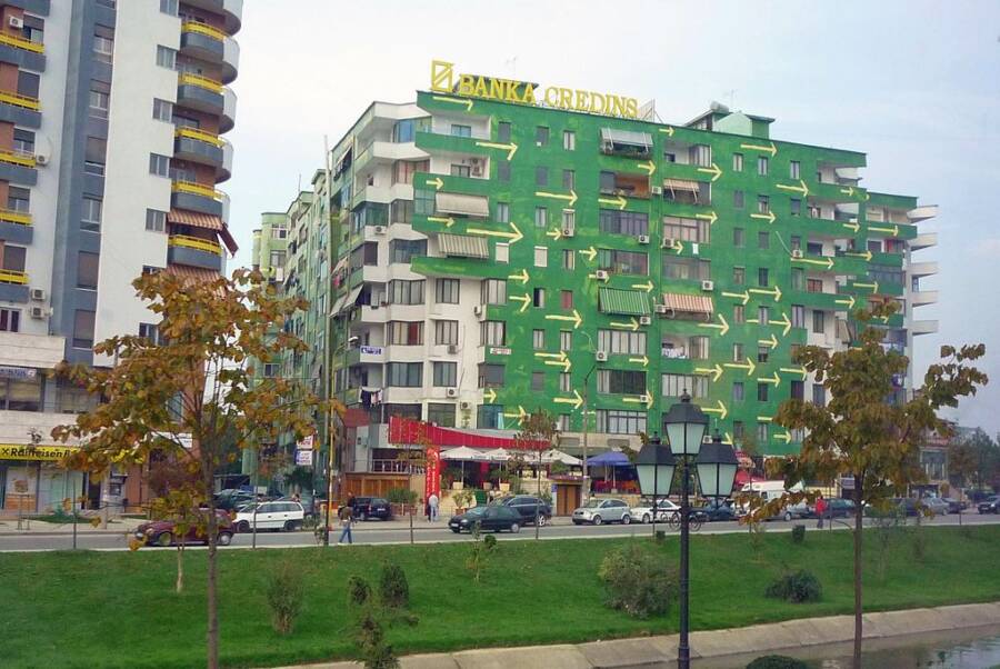 Arrows Painted On Green Building